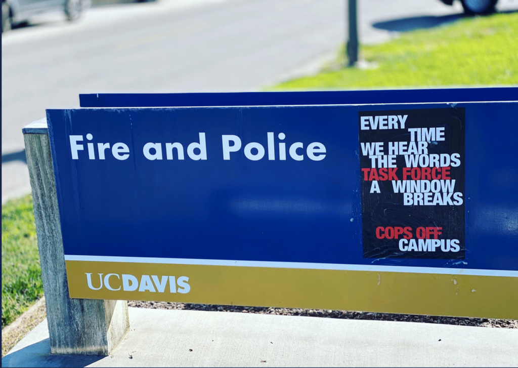 poster wheat pasted to UCD police station sign: "every time we hear the words 'task force' a window breaks"
