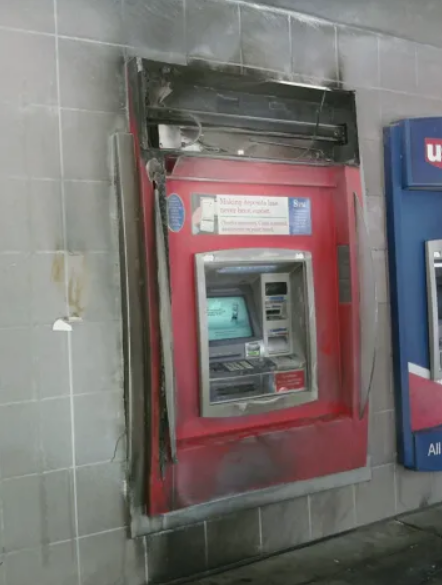 red US Bank ATM with smoke and burn damage